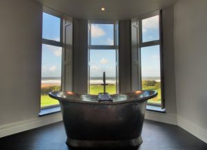 Hotel bedroom with roll-top bath and sea view Woolacombe 