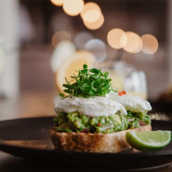 Poached Eggs with Avocado on Toast at bay Brasserie