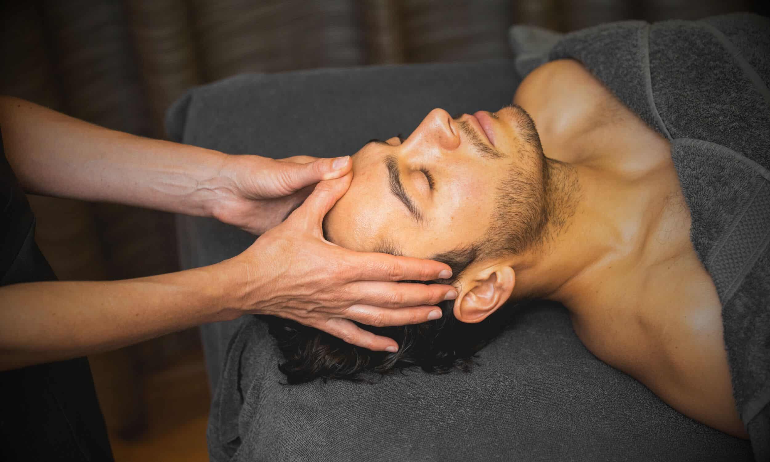 Male having scalp massage